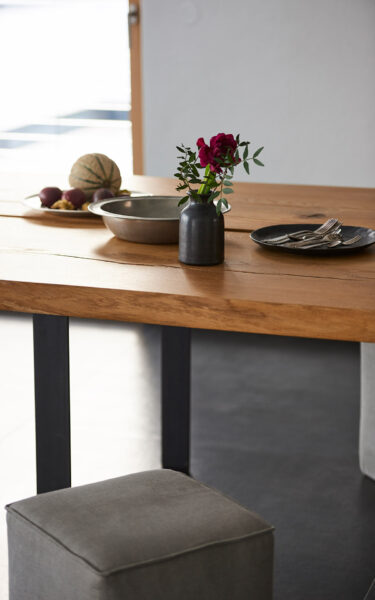 Kitchen out of unique natural stone, steel and oak